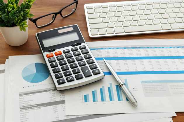 accounting sheets and calculator