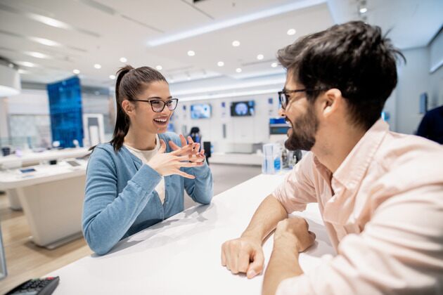 satisfied client at the front desk of a business