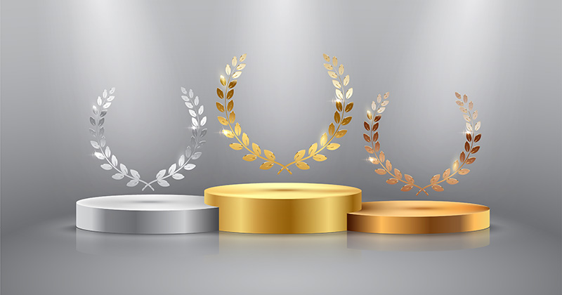 Graphique des podiums d'or, d'argent et de bronze avec les lauriers olympiques sur chacun d'eux.
